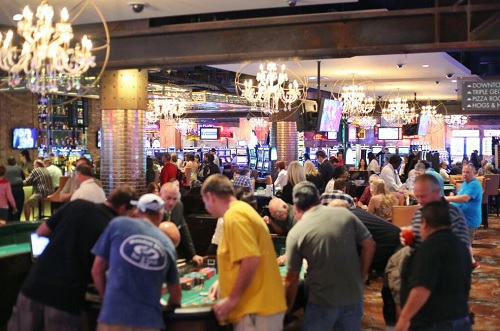 Gamblers play craps during the soft opening of the Downtown Grand