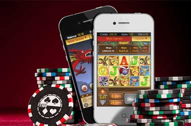 Mobile phones displaying online casinos with poker chips